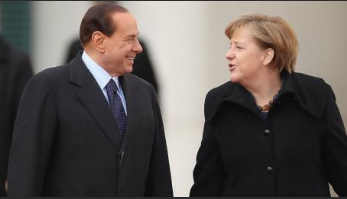 На фото Меркель и Берлускони.